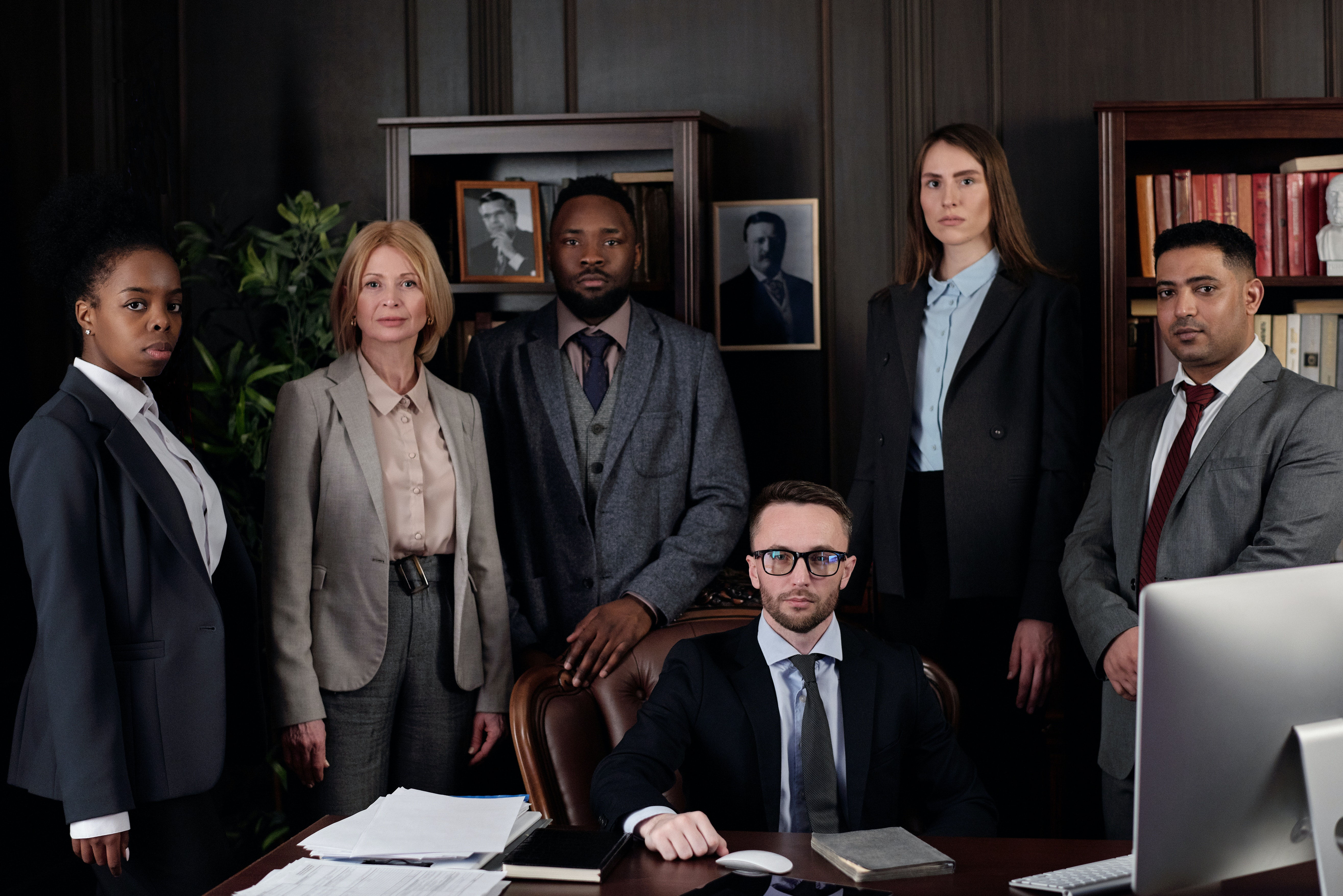 A team of Larch Developments, standing in front of a computer.